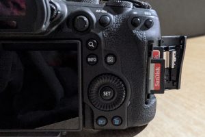 Back of a mirrorless camera displaying two Sandisk SD cards, ready for capturing and storing memories.